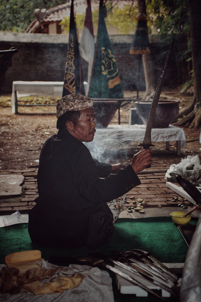 A ceremonial cleansing of a Keris dagger by an Indonesian practitioner in Jawa Barat, Indonesia.